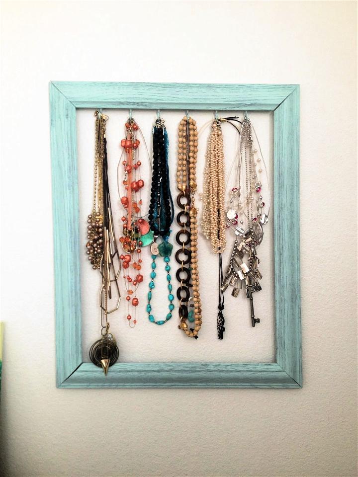 diy necklace holder to display your jewelry in an organized way