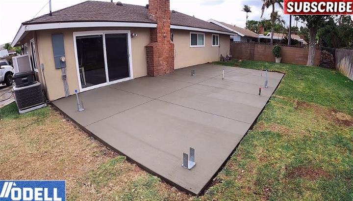 Build Backyard Concrete Patio with Underground Utilities