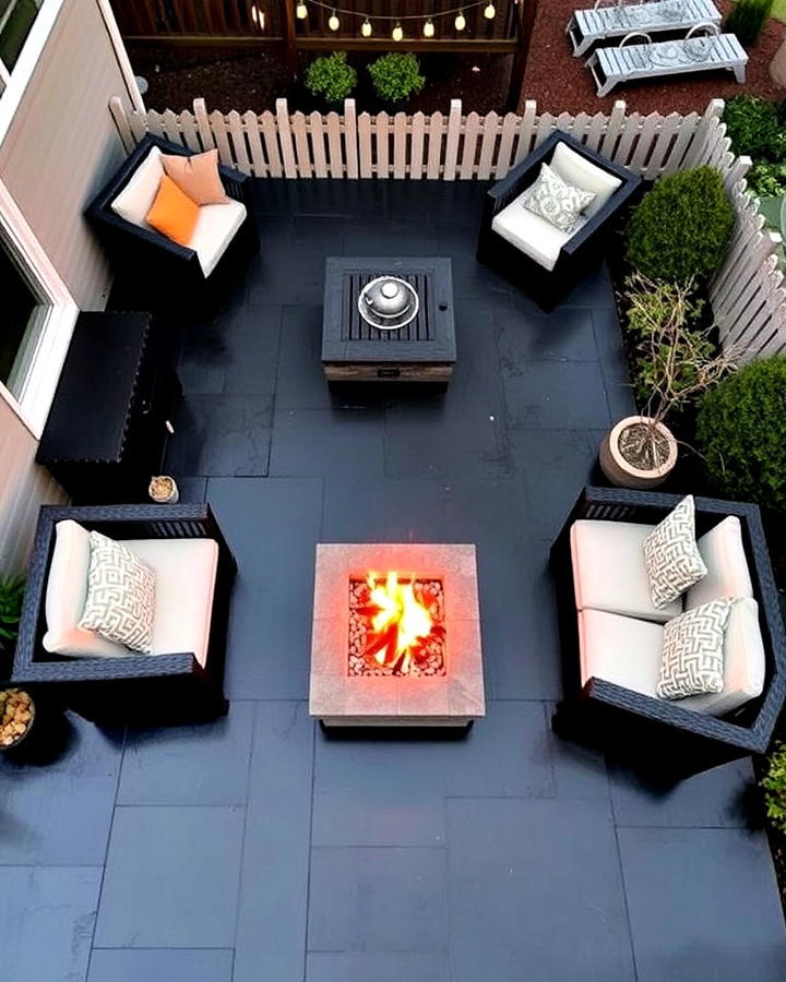 Black Concrete Patio With a Fire Pit