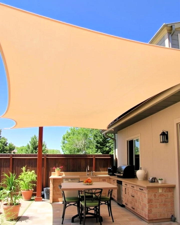 canvas shade sail for a casual outdoor kitchen