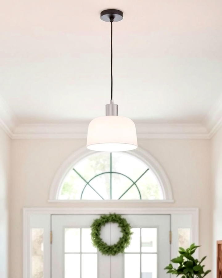 white pendant light with black cord