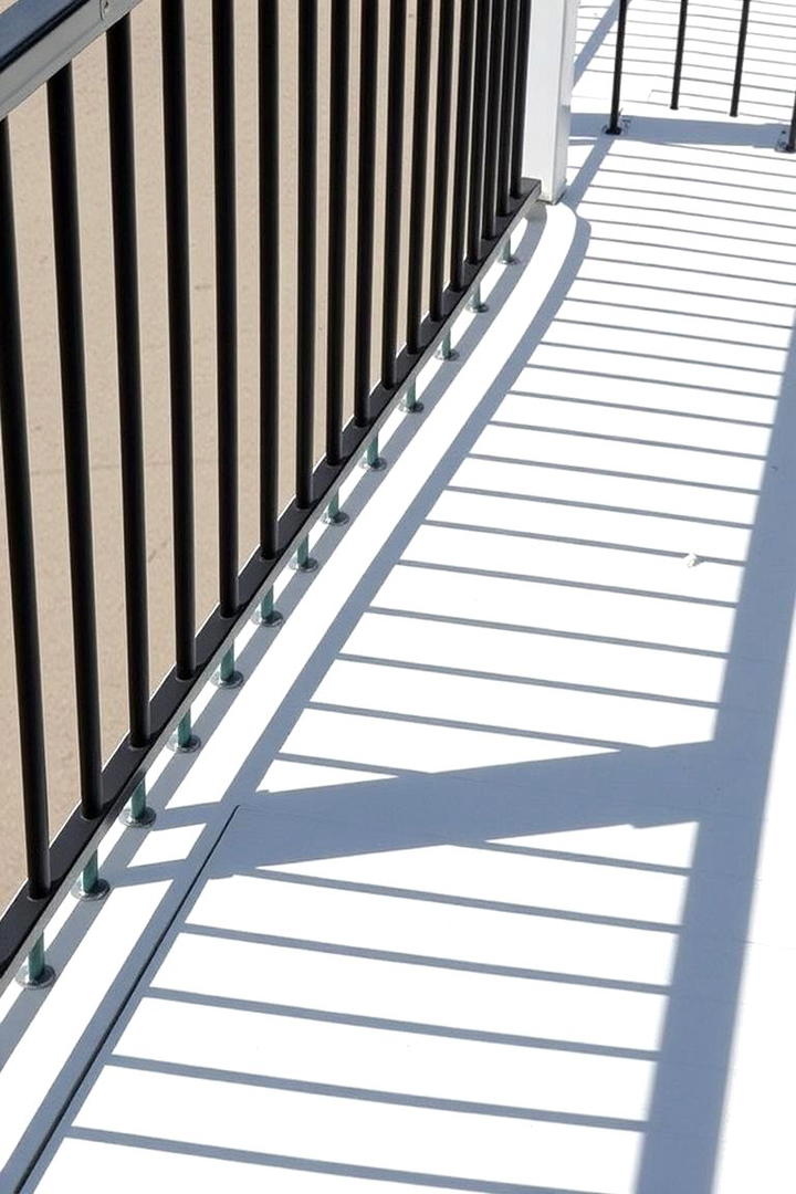 Bold Vertical Lines - 30 Metal Deck Railing Ideas