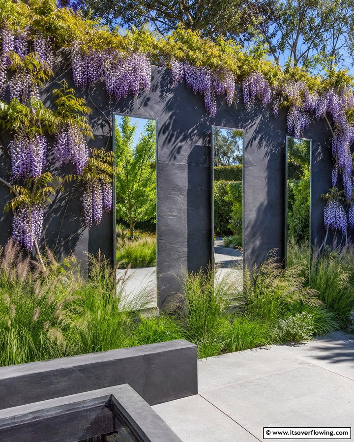 Add Vertical Interest With Tall Mirrors - 25 Garden Mirror Ideas to Enhance Outdoor Spaces