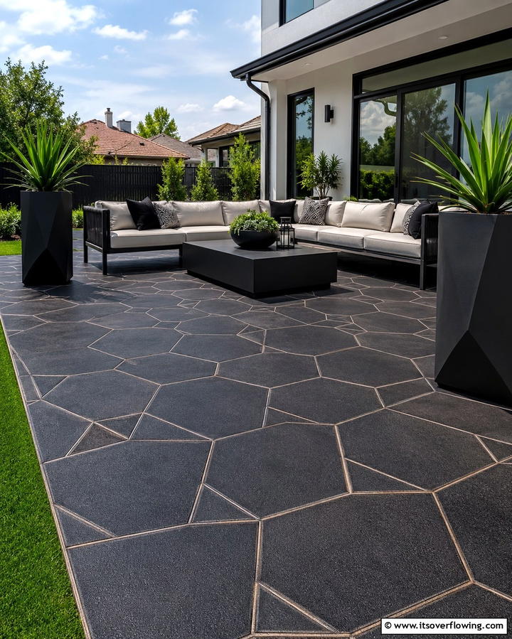 Adding Custom Geometric Patterns - 25 Black Concrete Patio Ideas for Modern Outdoor Spaces