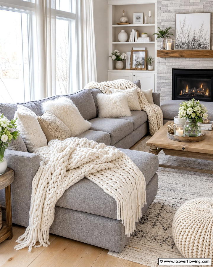 Adding Textured Throws for Warmth - 25 Grey Sectional Living Room Ideas for Modern Homes