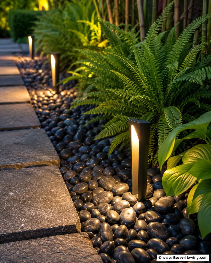 Ambient Pathway Lighting Accents - 30 Natural Black River Rock Landscaping Ideas for Texture