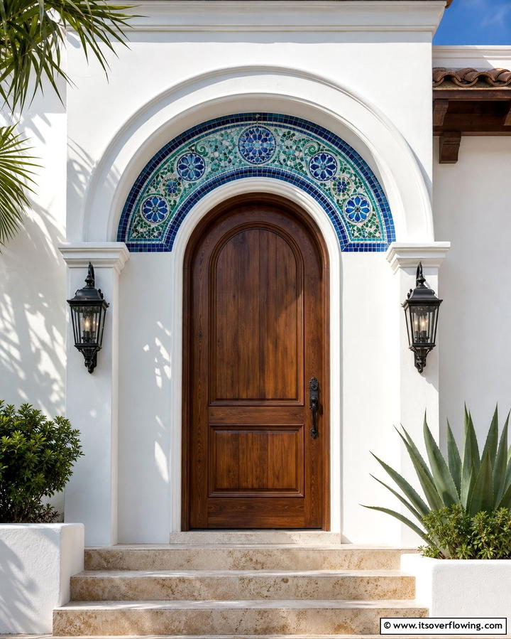 Arched Doors with Mosaic Detailing - 25 Mediterranean Front Door Ideas for a Warm Welcome