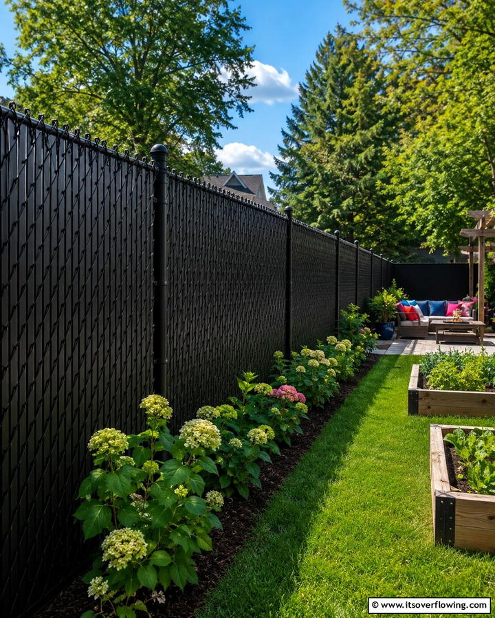 Black Chain Link Fence with Privacy Slats - 25 Black Fence Ideas for Modern Outdoor Spaces
