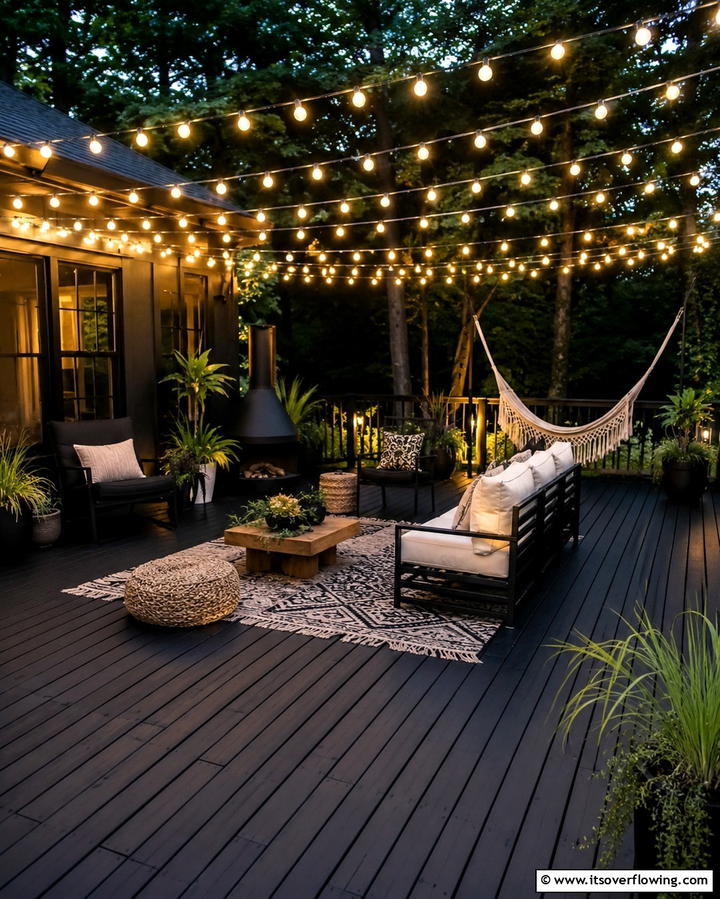 Black Deck with String Lights - 25 Black Deck Ideas for a Bold Outdoor Statement