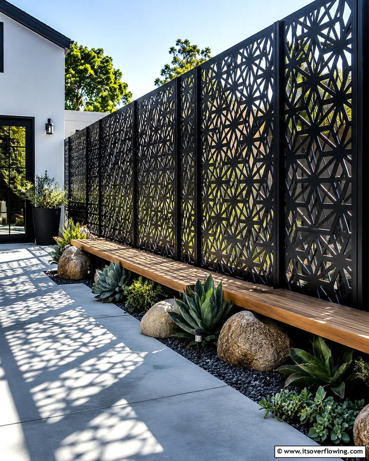 Black Fence with Decorative Panels - 25 Black Fence Ideas for Modern Outdoor Spaces