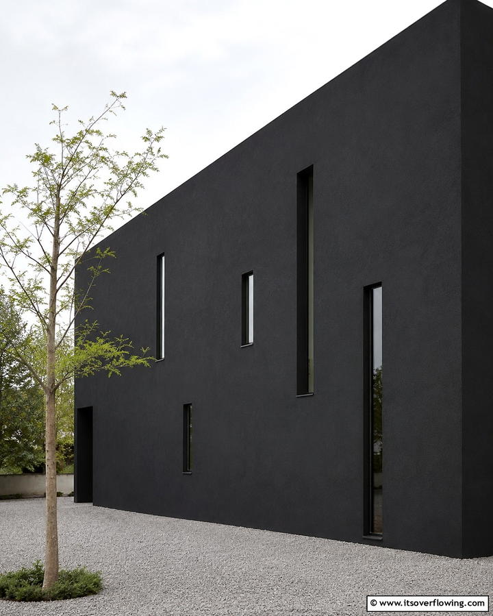Black House with Minimalist Windows - 25 Modern Black Houses for a Bold Statement
