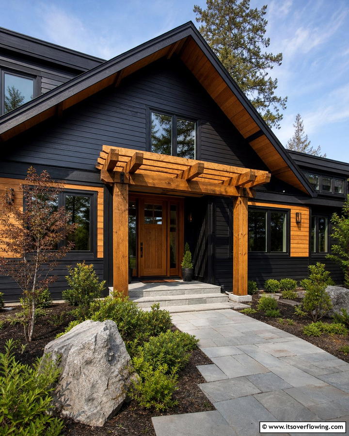 Black Siding with Natural Wood Accents - 25 Black Siding House Ideas for a Bold and Modern Look