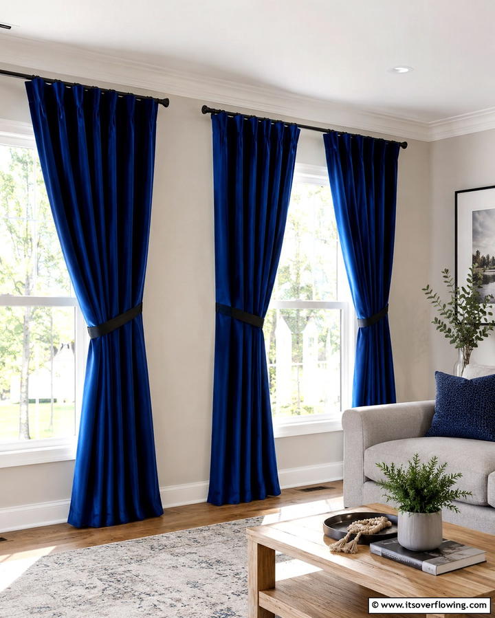 Blue Curtains with Black Tiebacks - 25 Bold Black and Blue Living Room Ideas for a Statement