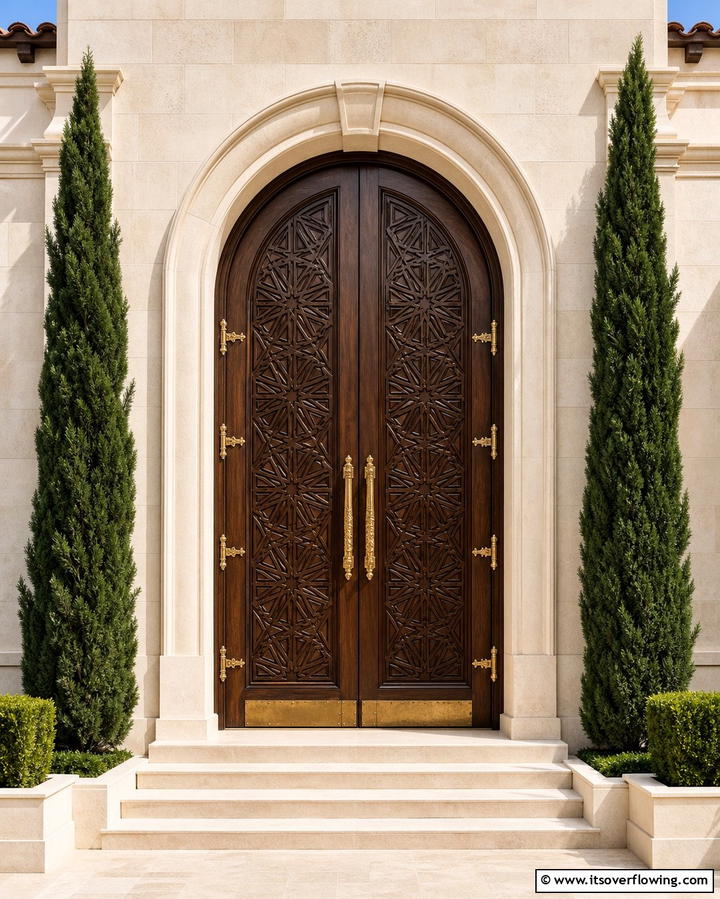 Carved Wooden Doors with Geometric Patterns - 25 Mediterranean Front Door Ideas for a Warm Welcome