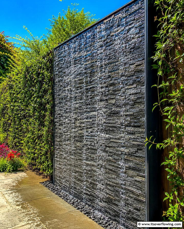 Cascading Rock Wall - 25 Pondless Waterfall Design Ideas for a Serene Backyard
