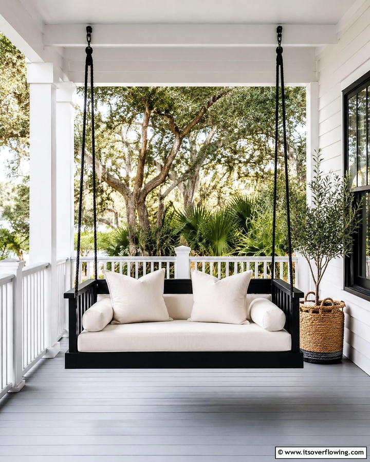 Chic Black Porch Swing - 30 Inviting Black Porch Ideas for a Modern Outdoor Oasis