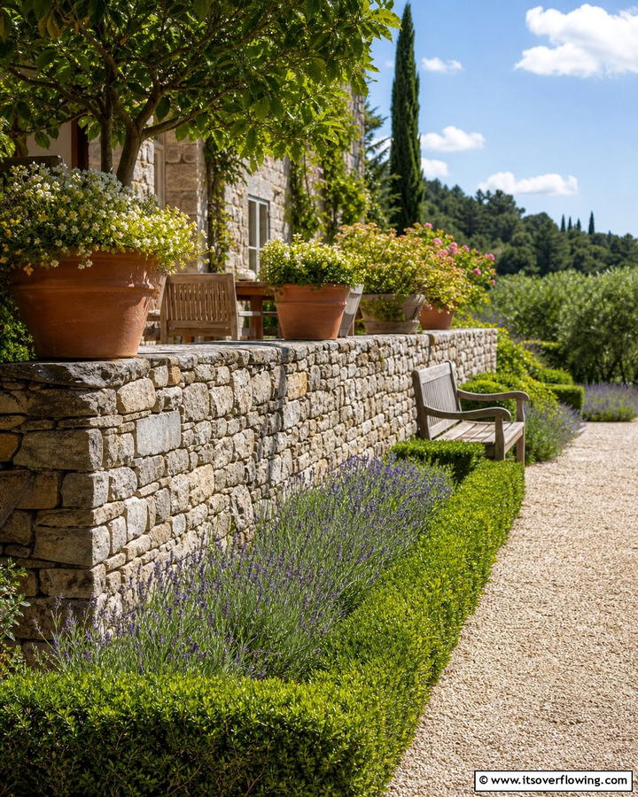 Chic Cobblestone Garden Wall - 30 Natural Stone Wall Ideas for Rustic Outdoor Landscapes