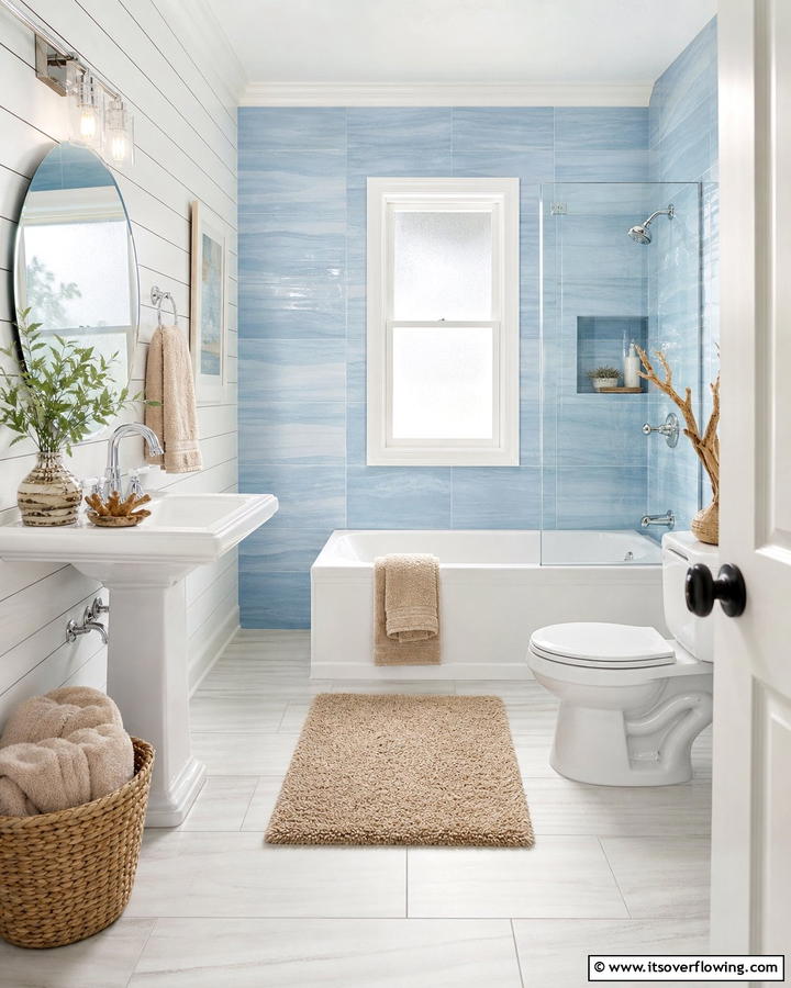 Coastal Bliss with Soft Blue Tiles - 25 Stunning Blue Tile Bathroom Ideas for a Fresh Look