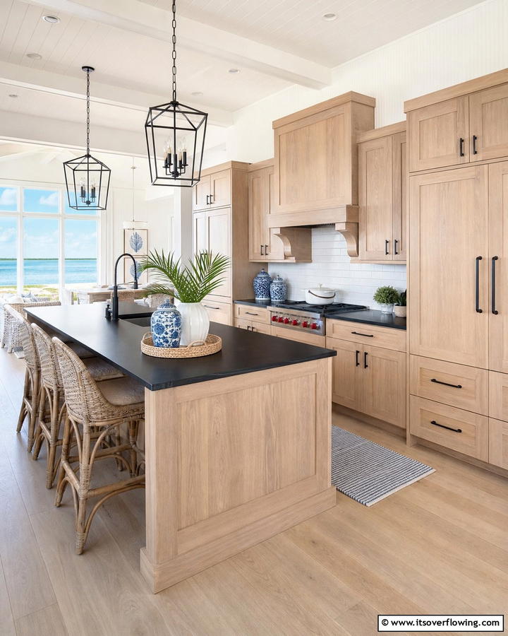 Coastal Comfort with Light Brown Hues - 25 Brown Kitchen Cabinets With Black Countertops