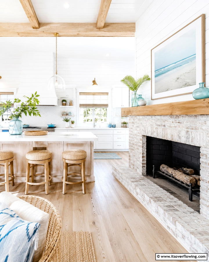 Coastal Kitchen with a Whitewashed Fireplace - 25 Kitchens With Fireplaces for a Unique Cooking Space