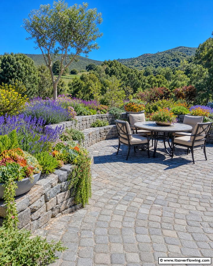 Cobblestone Patio with Integrated Planters - 20 Cobblestone Patio Ideas for a Rustic Outdoor Space