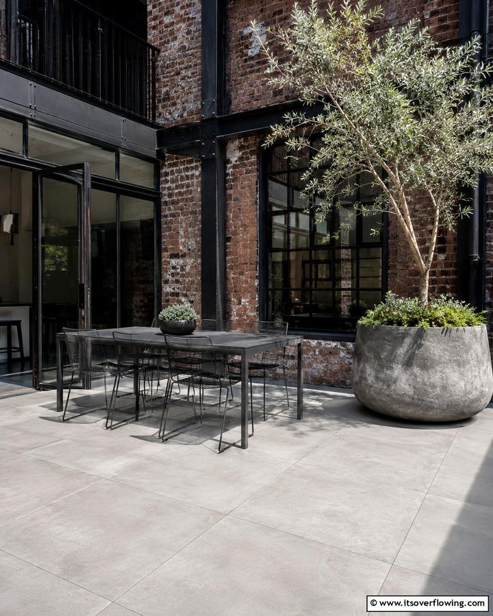 Concrete Look Tiles for Industrial Chic - 25 Patio Tile Ideas to Upgrade Your Outdoor Flooring