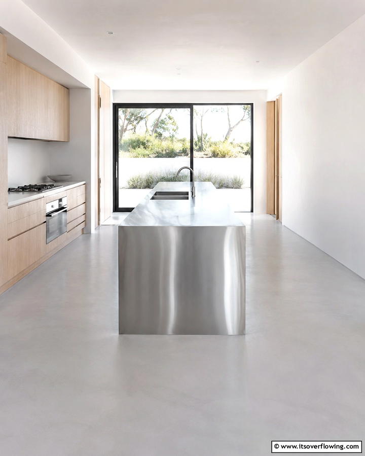 Concrete with Embedded Stones - 30 Industrial Chic Concrete Floor Kitchen Design Concepts