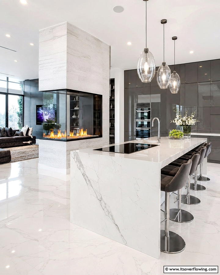 Contemporary Kitchen with a Glass Enclosed Fireplace - 25 Kitchens With Fireplaces for a Unique Cooking Space