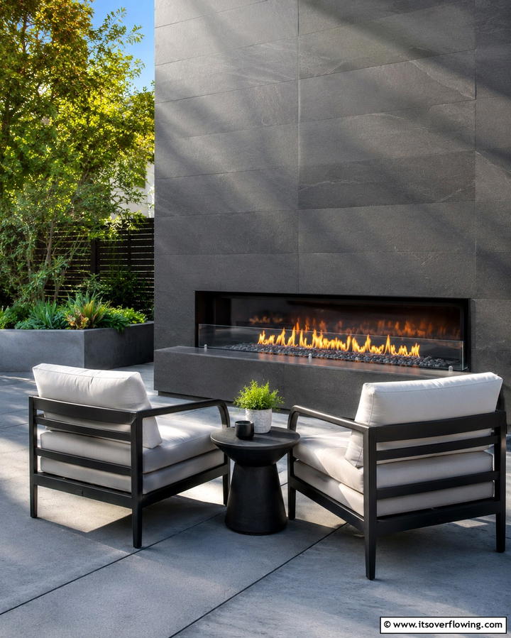Contemporary Linear Fireplace with Glass Shield - 25 Outdoor Fireplace Ideas to Enhance Your Backyard