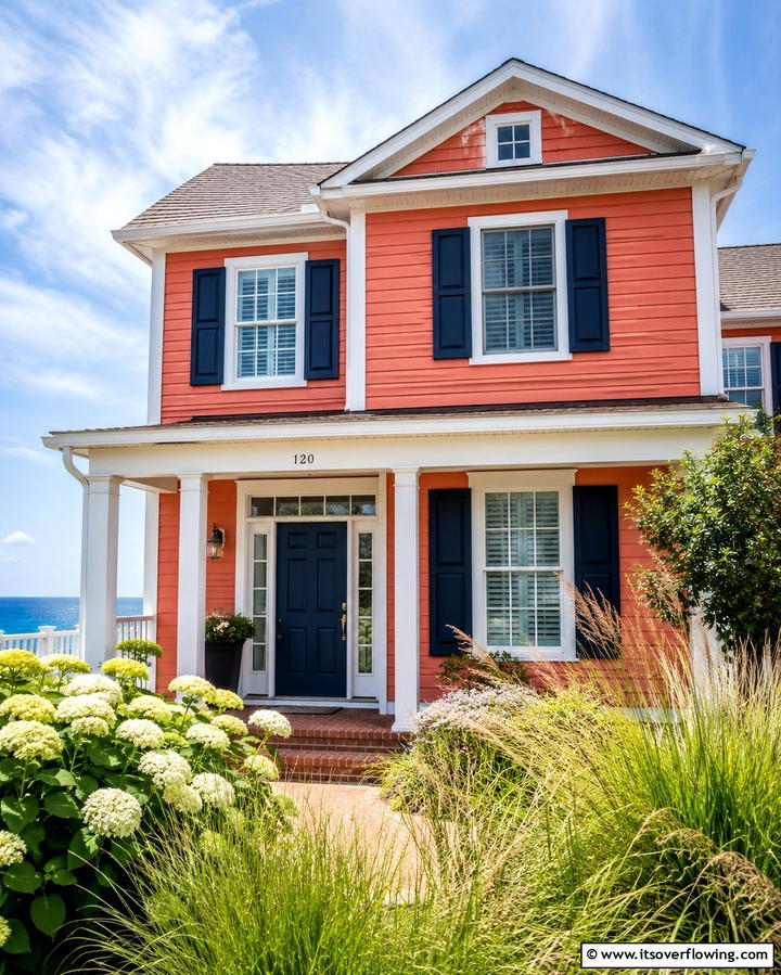 Coral Orange with Navy Blue Accents - 25 Orange House Exterior Ideas for a Bold Look