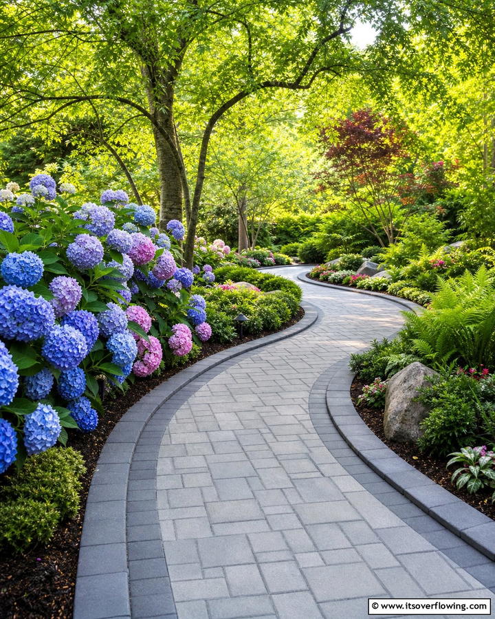 Curved Pathway for Organic Flow - 20 Grey Paver Walkway Ideas for a Modern Landscape
