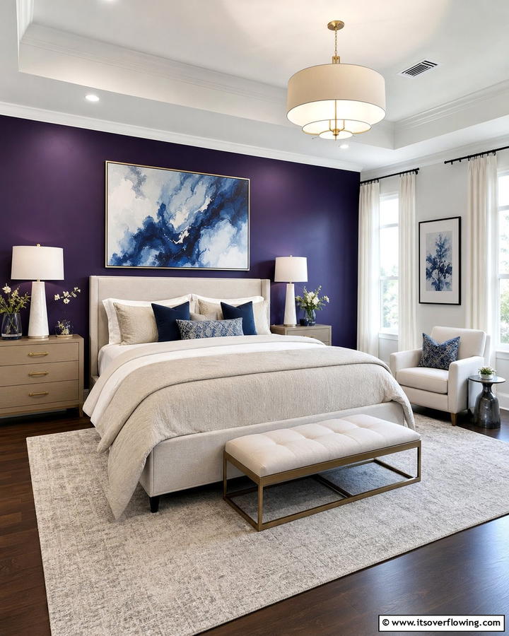 Deep Purple Accent Wall with Blue Artwork - 20 Blue and Purple Bedroom Ideas- Vibrant & Cozy Designs