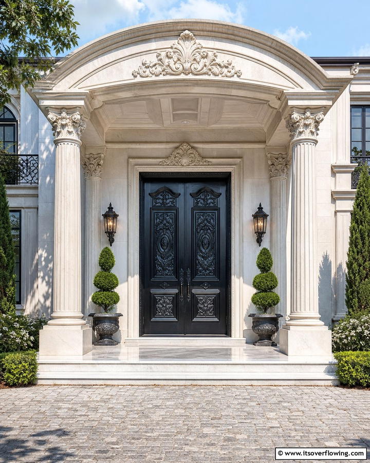 Elegant Black with Carved Detailing - 21 Black Front Door Ideas for Bold First Impressions