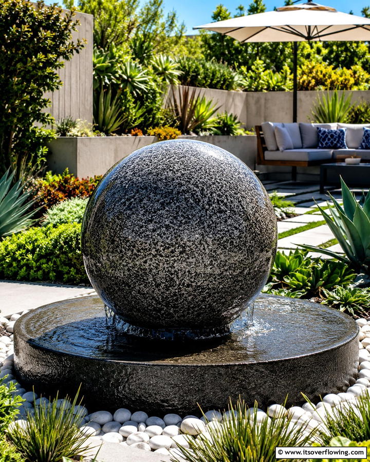 Floating Sphere Fountain - 25 Backyard Fountain Ideas for a Serene Outdoor Space