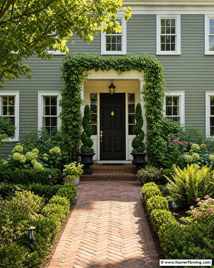 Framing the Door with Greenery - 20 Sage Green House With Black Door Design Ideas
