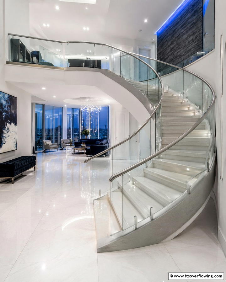 Glass Balustrades for a Sleek Appeal - 30 Elegant Curved Staircase Designs to Elevate Your Home’s Style