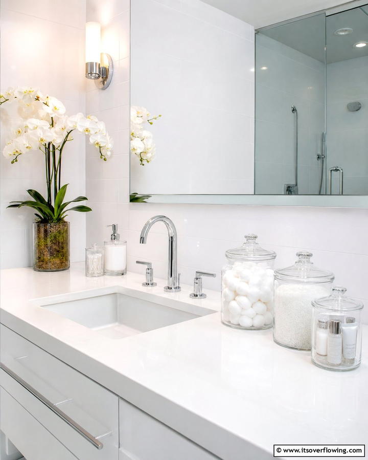 Glass Canisters for Minimalist Storage - 25 Bathroom Counter Organization Ideas for a Clutter-Free Space