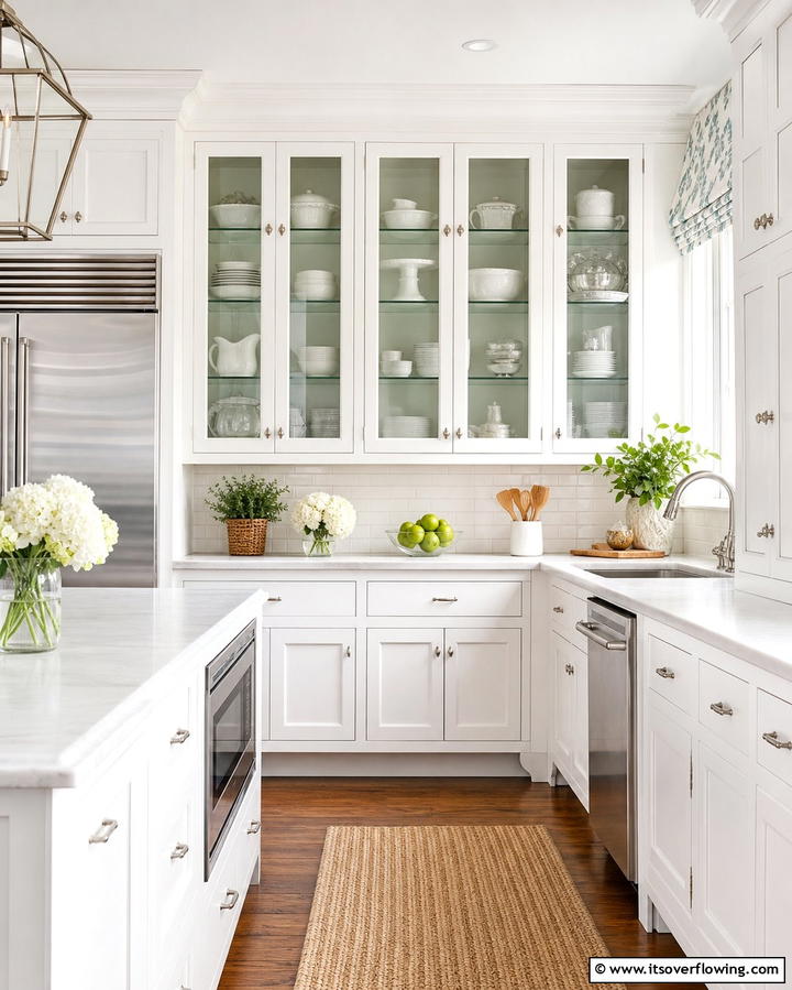 Glass Front Cabinets for a Light and Airy Feel - 25 White Kitchen with Stainless Steel Appliances Ideas