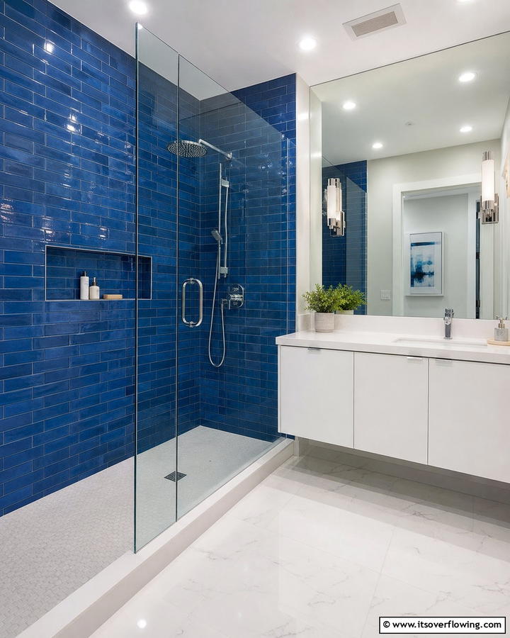 Glossy Sapphire Shower Walls - 25 Stunning Blue Tile Bathroom Ideas for a Fresh Look