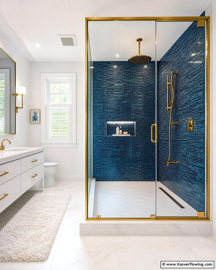Gold Shower Enclosure with Blue Tiles - 25 Blue and Gold Bathroom Ideas for a Luxurious Retreat