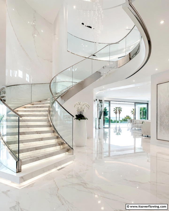 Graceful Glass Railings - 30 Elegant Curved Staircase Designs to Elevate Your Home’s Style