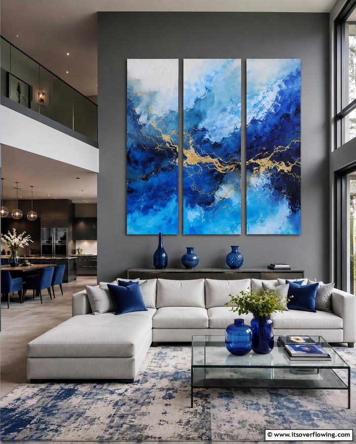 Grey Walls with Blue Artwork - 30 Soothing Blue & Grey Living Room Designs for Relaxing Spaces