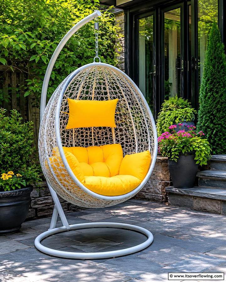 Hanging Chair Retreat - 25 Townhouse Patio Ideas for Small Outdoor Spaces