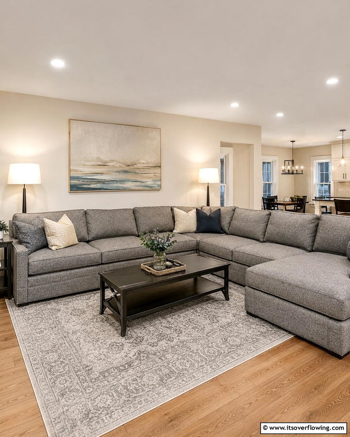 Highlight with Warm Lighting - 30 Grey Couch Living Room Styling Ideas for Cozy Spaces