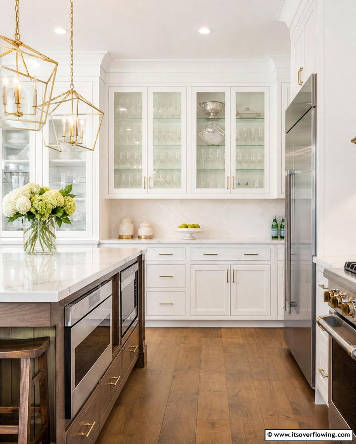 Incorporate Glass Front Cabinets for an Airy Look - 25 White Kitchen with Stainless Steel Appliances Ideas