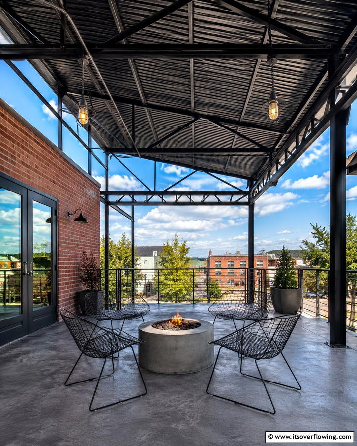 Industrial Appeal with Exposed Metal Framework - 25 Metal Roof Porch Design Ideas for a Durable Space