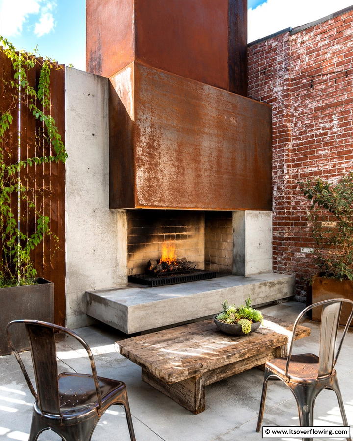 Industrial Style Fireplace with Metal Accents - 25 Outdoor Corner Fireplace Ideas for Cozy Nights