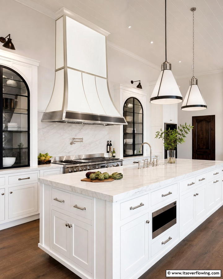 Install a Statement Range Hood - 25 White Kitchen with Stainless Steel Appliances Ideas