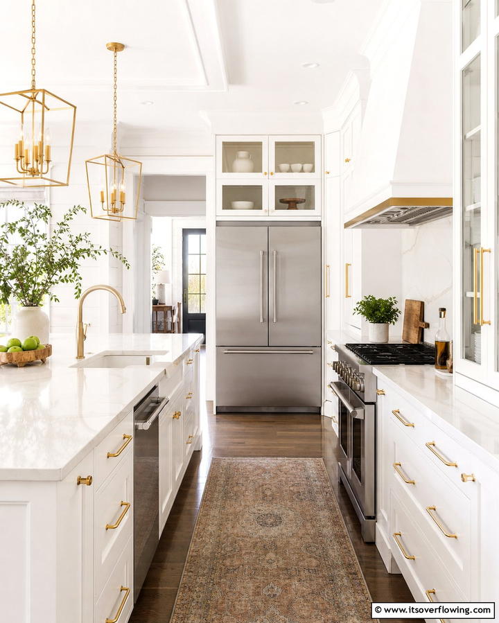 Introduce Pops of Metallic Accents - 25 White Kitchen with Stainless Steel Appliances Ideas