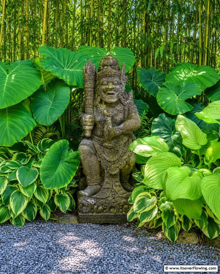 Island Inspired Garden Statues - 25 Tropical Garden Ideas for a Lush Outdoor Oasis